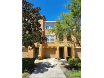 Attractive two-story townhome with driveway and landscaping at 7365 Black Walnut Way, Lakewood Ranch, FL 34202
