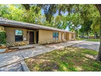 Charming single-story home with stone accents, well-maintained lawn, and mature trees at 5412 11Th Street E Cir # 41, Bradenton, FL 34203