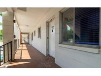 Building hallway with access to individual condo units at 2425 Flamingo Blvd # K28, Bradenton, FL 34207