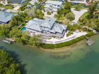 Waterfront property with a large house and private dock at 750 Penfield St, Longboat Key, FL 34228