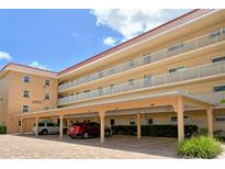 Condo building with parking and landscaping at 1350 N Portofino Dr # 310, Sarasota, FL 34242