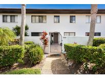 Attractive entryway with lush landscaping and a welcoming gate at 3500 El Conquistador Pkwy # 339, Bradenton, FL 34210