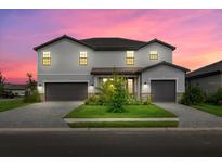 Two-story house with a gray exterior and two-car garage at 15425 White Linen Dr, Bradenton, FL 34211