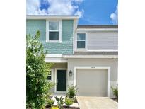 Two-story home with teal and beige siding at 3059 Novara Ln, Lakewood Ranch, FL 34211