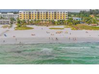 Aerial view of beach with hotel and people swimming at 915 Seaside Dr # 607 Weeks 14-15, Sarasota, FL 34242