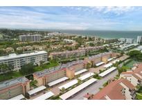 Aerial view of condos near the beach and tennis courts at 1300 N Portofino Dr # 208, Sarasota, FL 34242