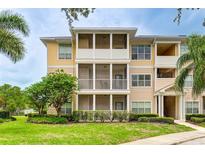 Apartment building with light beige siding and balconies at 4802 51St W St # 1305, Bradenton, FL 34210