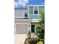 Two-story home with light gray and teal siding at 3055 Novara Ln, Lakewood Ranch, FL 34211