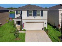 Two-story house with a two-car garage and a well-maintained yard at 2966 Great Abaco Way, Bradenton, FL 34208