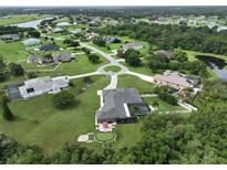 Aerial view of house and surrounding neighborhood at 17706 Bridlewood Ct, Parrish, FL 34219