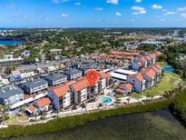 Aerial view of condo building near the water at 1602 Stickney Point Rd # 305, Sarasota, FL 34231