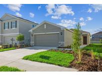 Charming single-Gathering home featuring a two-car garage and well-manicured front lawn at 5917 Laurelcrest Gln, Palmetto, FL 34221