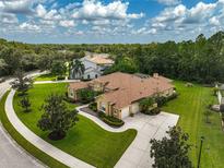 Stunning home with well-manicured landscaping, circular driveway, and a three car garage at 14526 17Th E Ave, Bradenton, FL 34212