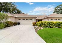 House with attached two car garage and landscaped yard at 4113 Putter Pl, Bradenton, FL 34203