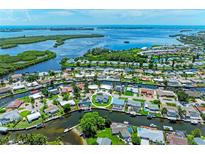 Waterfront property with boat access in a coastal community, surrounded by canals and lush greenery at 5111 Coral Blvd, Bradenton, FL 34210