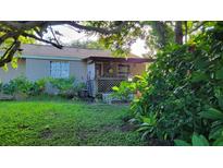 Cozy single-story home with a covered porch at 12004 Big Bend Rd, Riverview, FL 33579
