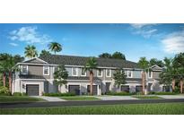 Modern townhome community with attached garages and lush landscaping at 6227 Dry Tortugas Dr, Sarasota, FL 34241