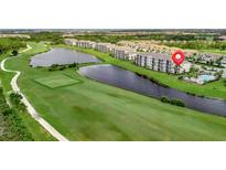 Aerial view of condo community near golf course and lake at 17724 Gawthrop Dr # 201, Bradenton, FL 34211