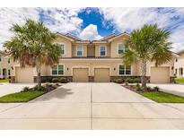 Front view of two-story townhouses at 8269 Enclave Way # 103, Sarasota, FL 34243