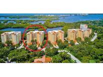 Aerial view of luxury condo building with water access at 393 N Point Rd # 503, Osprey, FL 34229