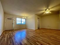 Bright dining room with laminate wood floors and a chandelier at 4480 Ironwood Cir # 305A, Bradenton, FL 34209