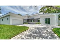 Modern two-story home with a gray and white exterior at 2231 Wood St, Sarasota, FL 34237
