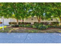 Charming single story home nestled amongst lush landscaping at 780 Tarawitt Dr, Longboat Key, FL 34228