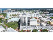 Aerial view of Insula Buchanan with city views, showing balconies, rooftop pool, and the building's design at 50 Central Ave # 17Phb, Sarasota, FL 34236