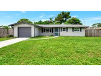 Updated ranch home with a large grassy yard at 2900 Siesta Dr, Venice, FL 34293