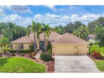 Single-Gathering home with landscaped yard and driveway at 12209 Clubhouse Dr, Lakewood Ranch, FL 34202