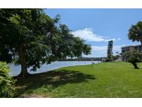 Scenic lakefront view, lush landscaping at 3697 Lake Bayshore Dr # H-109, Bradenton, FL 34205