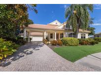 One-story house with a large driveway and landscaping at 4703 Clipper Dr, Bradenton, FL 34208