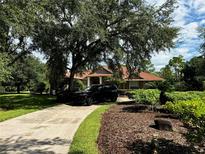 Luxury home exterior with driveway and landscaping at 22105 Deer Pointe Xing, Bradenton, FL 34202