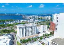 High-rise building near the waterfront with marina and city views at 101 S Gulfstream Ave # 4A, Sarasota, FL 34236