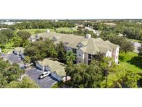 Multi-unit residential building with green roof and ample parking at 5122 Northridge Rd # 107, Sarasota, FL 34238