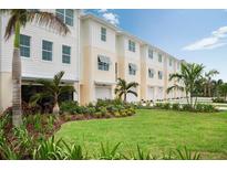 Modern townhomes with attached garages and landscaping at 9955 Key Haven Rd, Seminole, FL 33777