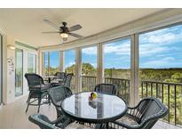 Spacious lanai with scenic wooded views at 409 N Point Rd # 502, Osprey, FL 34229