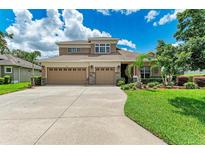Two-story home with three-car garage and landscaped yard at 337 Snapdragon Loop, Bradenton, FL 34212