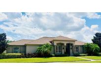 Single-Gathering home with tile roof, manicured lawn, and neutral color palette at 10228 Silverado Cir, Lakewood Ranch, FL 34202