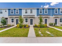 Charming townhomes with manicured lawns and inviting entrances on a bright day at 16647 San Nicola Pl, Lakewood Ranch, FL 34211