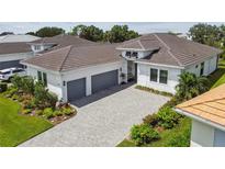 Luxury home with three-car garage and paver driveway at 4952 Surfside Cir, Bradenton, FL 34211