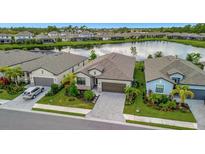 Luxury homes surrounding a tranquil lake at 19765 Fishhawk Trl, Venice, FL 34293