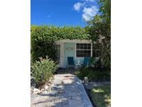 Charming waterfront cottage with lush landscaping and a relaxing patio at 1603 Gulf N Dr # 5, Bradenton Beach, FL 34217