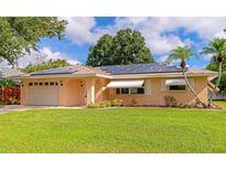 Charming single story home with solar panels and manicured lawn at 519 Bradenton Rd, Venice, FL 34293