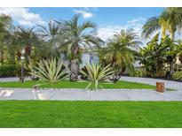 Home with lush landscaping and a welcoming walkway at 8975 Province St, Sarasota, FL 34240
