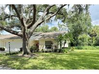 Ranch style home with carport and mature landscaping at 3925 Oakhurst Blvd # 3010, Sarasota, FL 34233