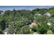 Aerial view of a house near the water at 875 Indian Beach Dr, Sarasota, FL 34234