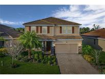 Two story home with tile roof and landscaping at 2824 Esmeralda Dr, Sarasota, FL 34243