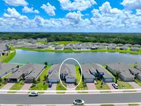 Aerial view of the house and neighborhood at 5827 Mezzana Run, Palmetto, FL 34221