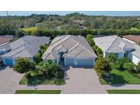 Luxury home community with tile roofs and paver driveways at 7745 Sandhill Lake Dr, Sarasota, FL 34241